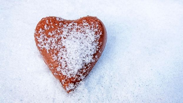 Chocolate heart in the snow