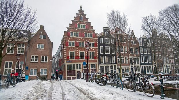 Snowy city Amsterdam in the Netherlands in winter