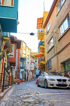 Authentic atmosphere of the old district in a Turkish city. Narrow street and old buildings. Turkey , Istanbul - 21.07.2020