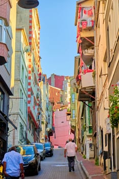 Authentic atmosphere of the old district in a Turkish city. Narrow street and old buildings. Turkey , Istanbul - 21.07.2020