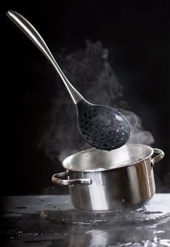 Bubbling water in a pan. Abstract background