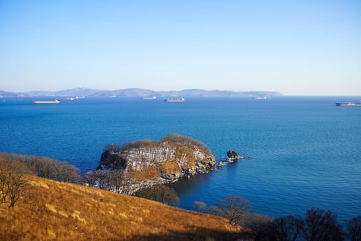Seascape with views of Nakhodka Bay and ships. Primorsky Krai, Russia