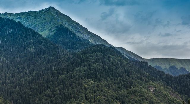 Natural landscape with mountains and forests against the sky. Abkhazia