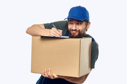 male working uniform box delivery by courier professional. High quality photo