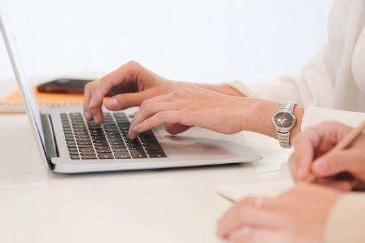 Closeup hand using computer laptop. Using online connect technology for business, education and communication. 