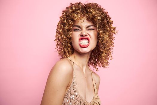 Stylish girl bared her teeth and curly hair T-shirt with sequins isolated background