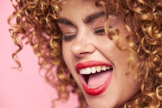 Attractive woman Curly hair closed eyes open mouth close-up charm cropped view
