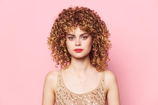 Pretty woman curly hair Red lips Look Forward glamor model pink background