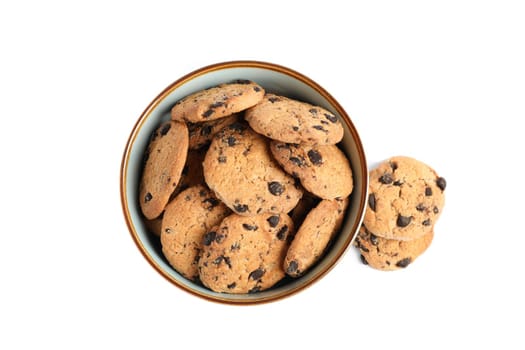 Bowl with tasty chocolate chip cookies on white background, top view