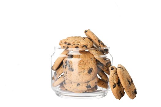 Glass jar with tasty chocolate chip cookies on white background