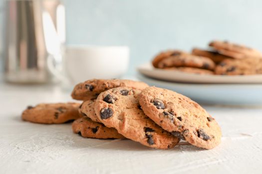 Homemade chocolate chip cookies on gray background, closeup