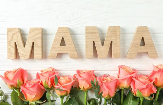 Beautiful orange roses and inscription Mom on white background, space for text