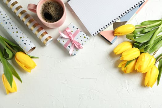 Beautiful yellow tulips and accessories on light background, space for text. Top view