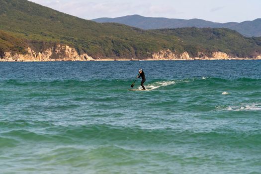 Seascape with a SAP surfer on a Board. Primorsky Krai, Russia