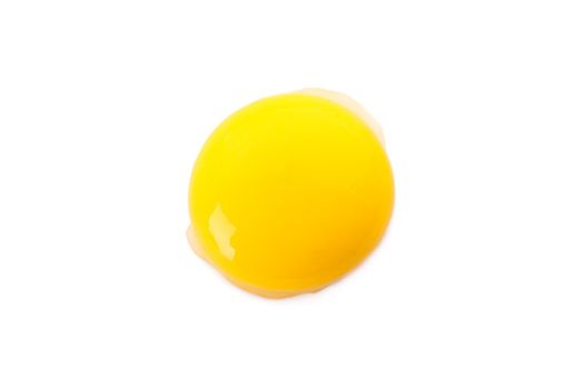 Raw egg yolk isolated on white background