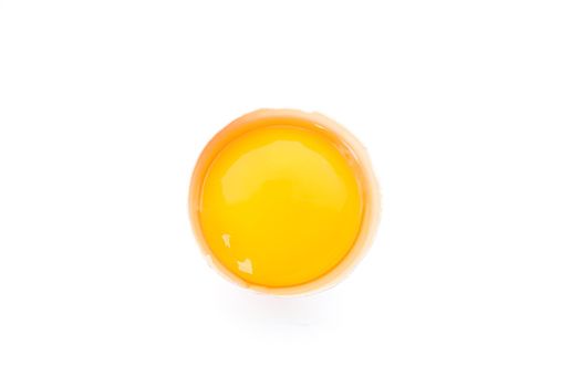 Half broken egg with yolk isolated on white background, top view