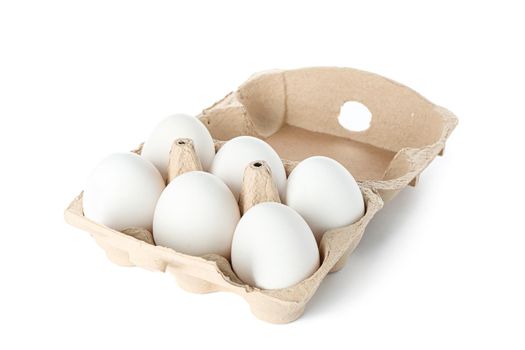 White chicken eggs in carton box isolated on white background