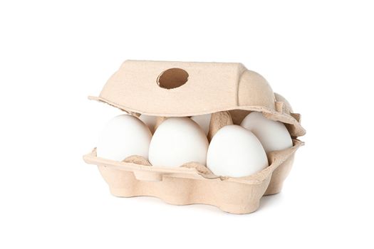 White chicken eggs in carton box isolated on white background