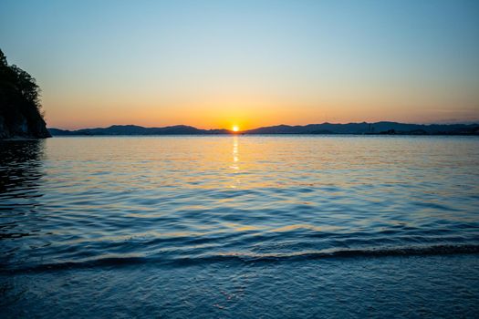 Marine landscape with views of a beautiful sunset. Nakhodka Bay, Russia