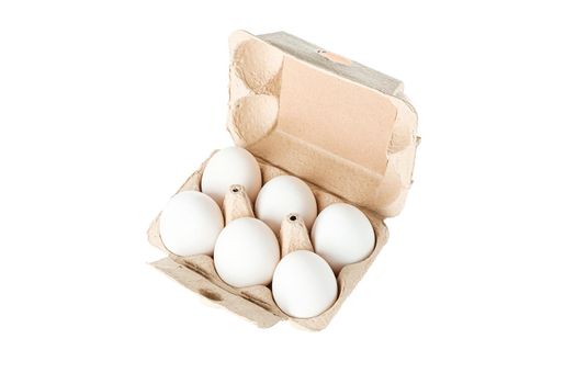 White chicken eggs in carton box isolated on white background