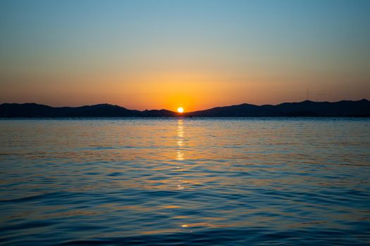 Marine landscape with views of a beautiful sunset. Nakhodka Bay, Russia