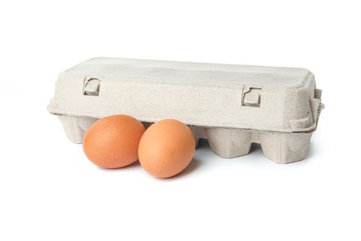 Carton box and chicken eggs isolated on white background
