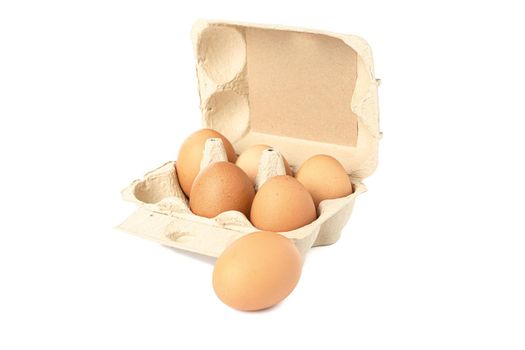 Brown chicken eggs in carton box isolated on white background