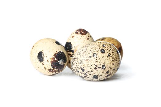 Raw quail eggs isolated on white background