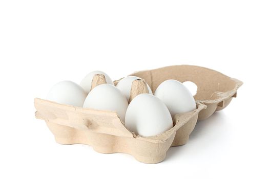 White chicken eggs in carton box isolated on white background