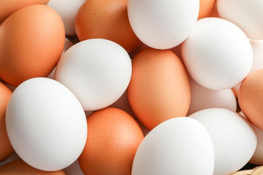 Many chicken eggs as background, top view and closeup