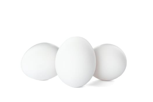 Few raw chicken eggs on white background