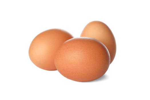 Few raw chicken eggs on white background