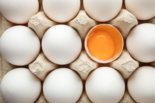 Chicken eggs in carton box as background, space for text