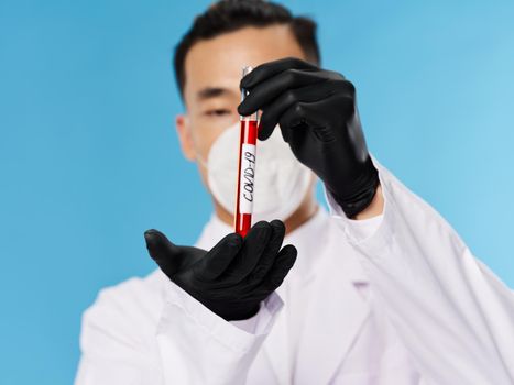 A man of Asian appearance. Laboratory blood test covid-19. High quality photo