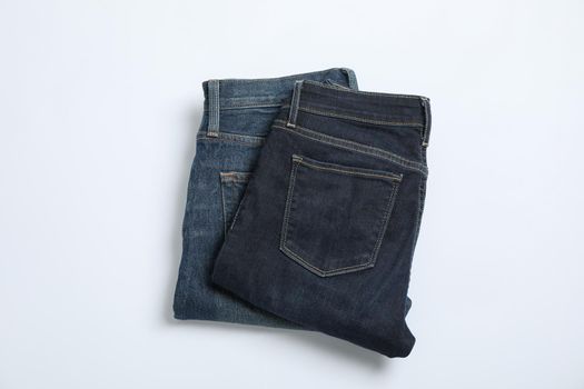 Jeans on white background, space for text