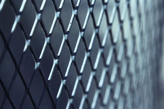 Grating with defocused rhombus shaped background. No people