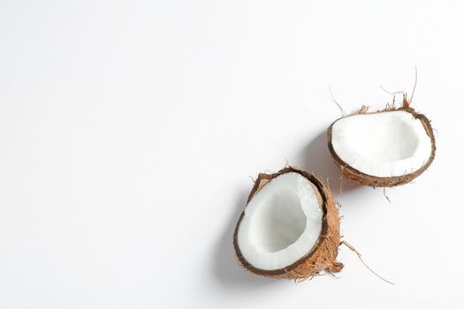 Split tropical coconut isolated on white background