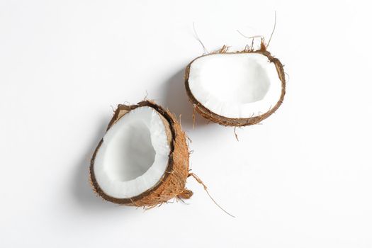 Split tropical coconut isolated on white background