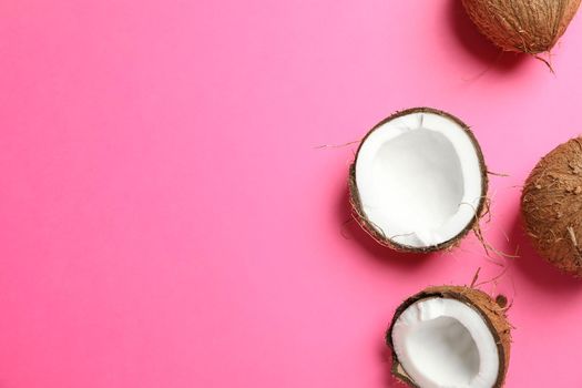 Tropical coconuts on color background, space for text