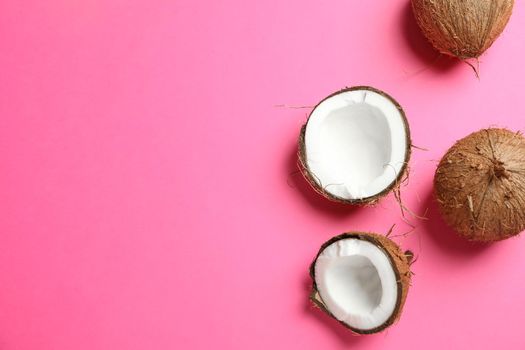 Tropical coconuts on color background, space for text