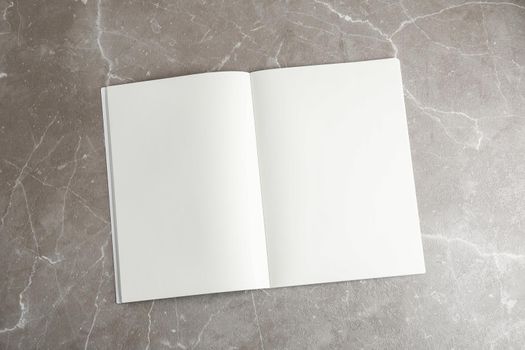 Clean copybook on grey table, space for text