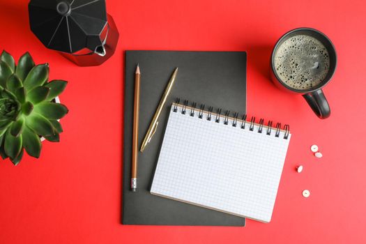 Flat lay composition with cup of coffee, copybooks, pencils and succulent plant, space for text