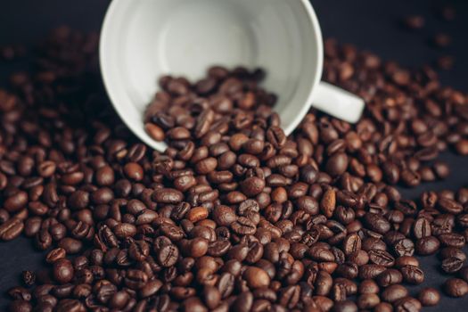 aromatic coffee beans on a dark background closeup close-up. High quality photo