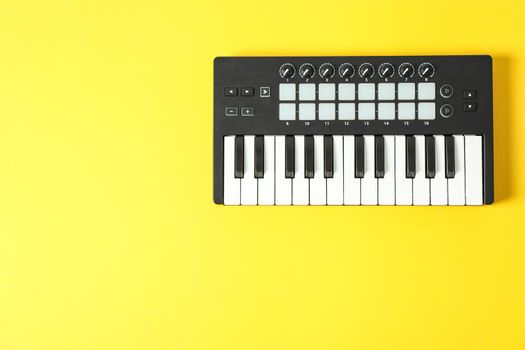 Midi keyboard on color background, space for text