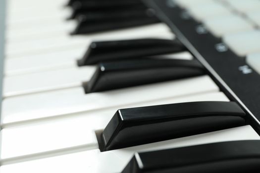 Portative modern midi keyboard as background, closeup