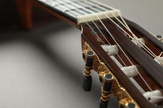 Beautiful classic guitar on light background, closeup