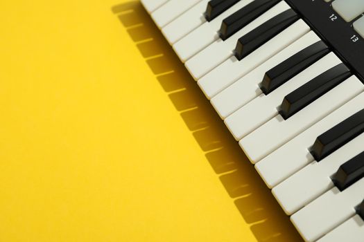 Midi keyboard on color background, space for text