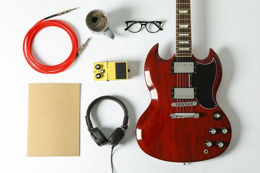 Flat lay composition with music accessories on white background