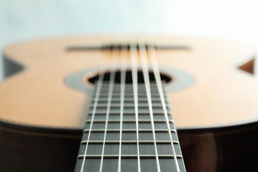 Beautiful six - string classic guitar on white background, closeup