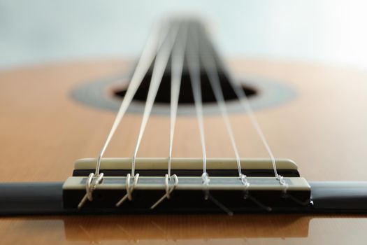 Beautiful six - string classic guitar on white background, closeup